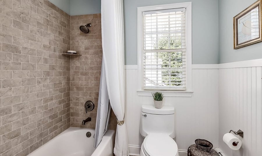 Full bathroom with shower and tub
