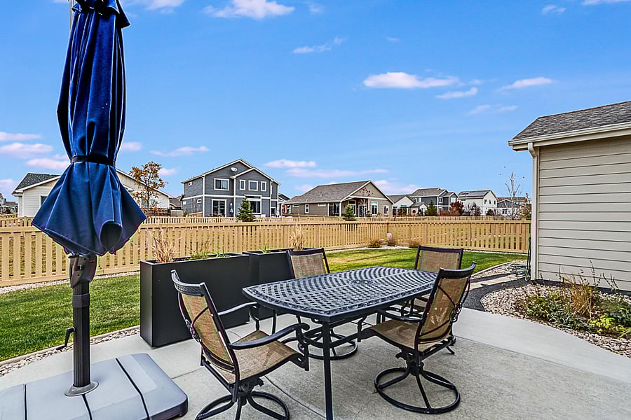 Patio with seating and shade.
