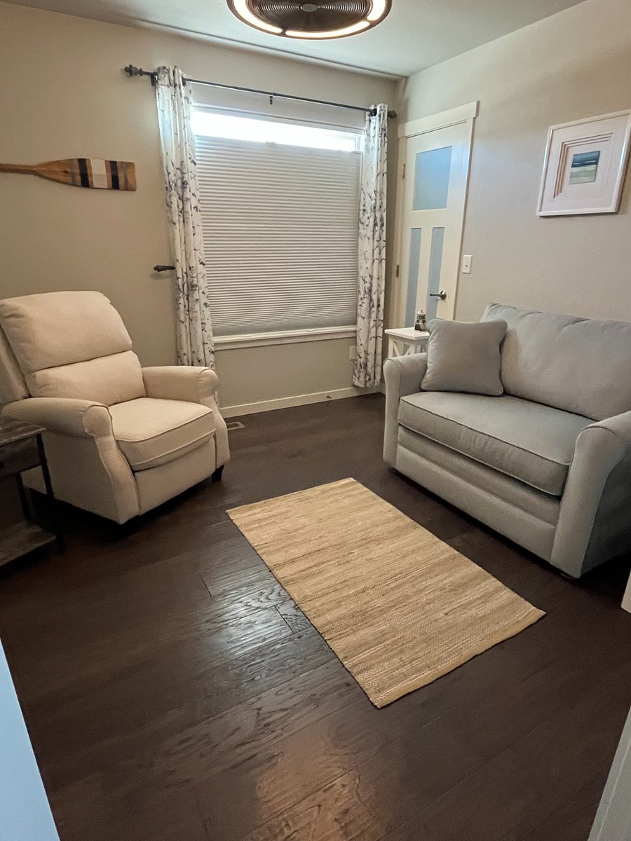 Plenty of comfortable seating in the den, featuring a recliner and couch, tv, and additional closet space for your belongings.