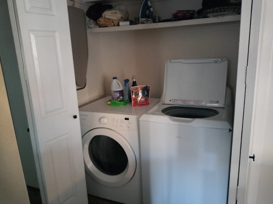 Washer and dryer in the house hallway.