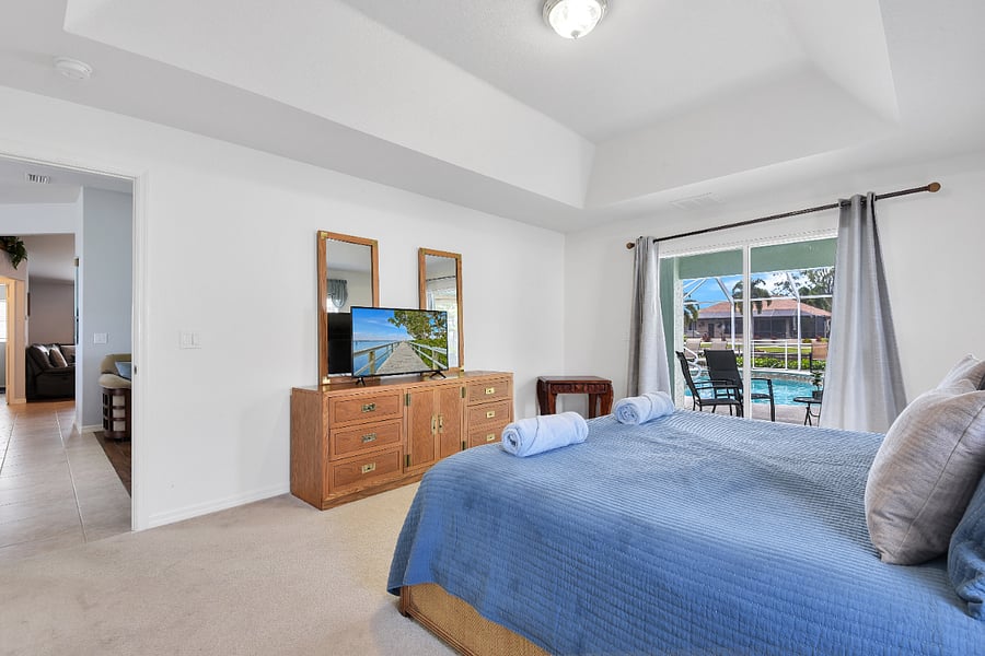 Luxury master suite. Wake up to pool and canal views right out the large double sliders.