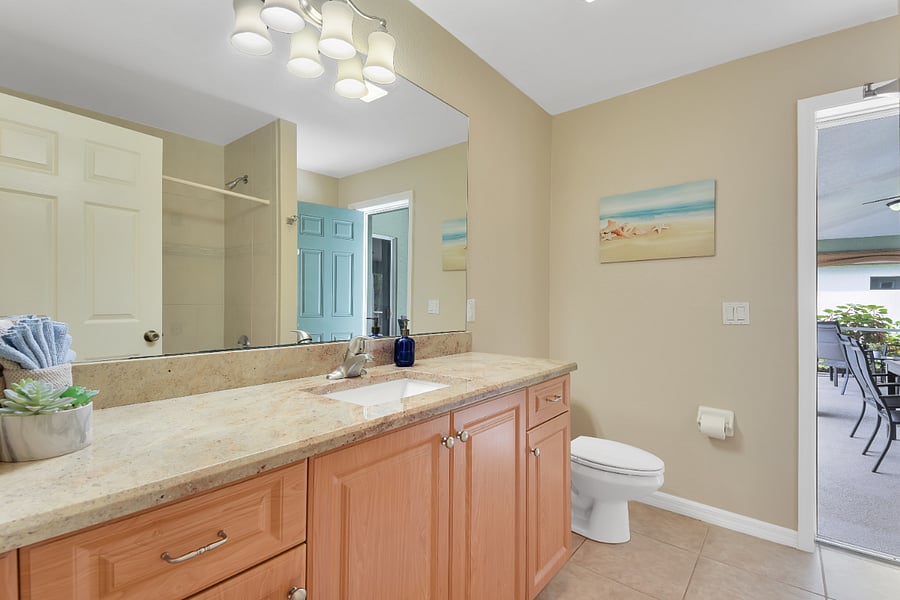 Second bathroom is accessible from inside and the pool area.