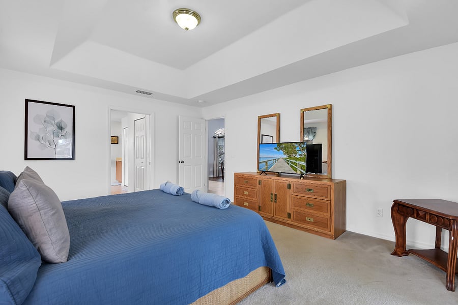Master bedroom has a TV and is on the opposite side of the home where you can have some space to yourself. Master bathroom is attached as well.