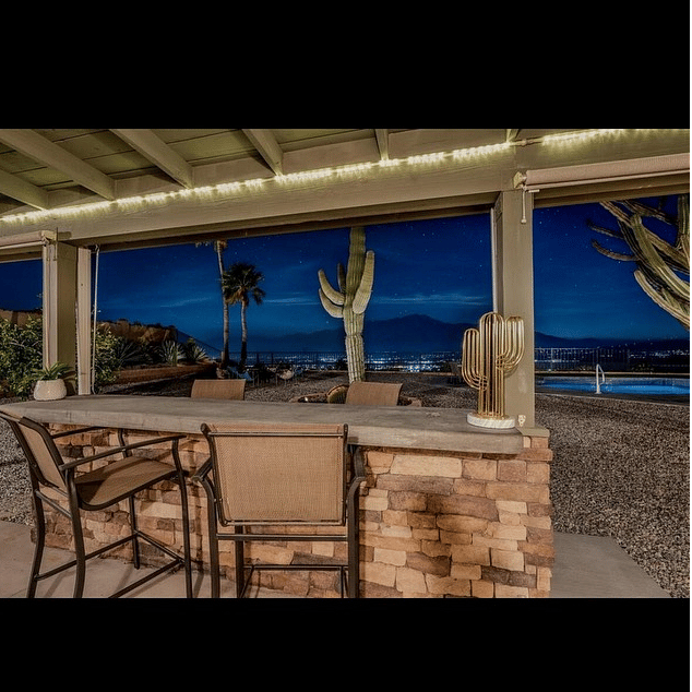 Outdoor bar next to gas grill