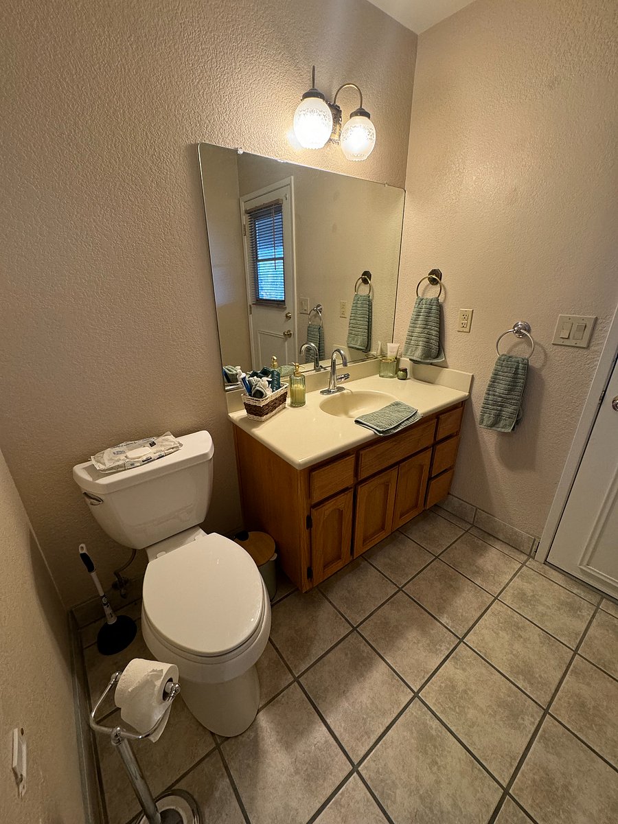 Hallway restroom with access to pool/outdoor area