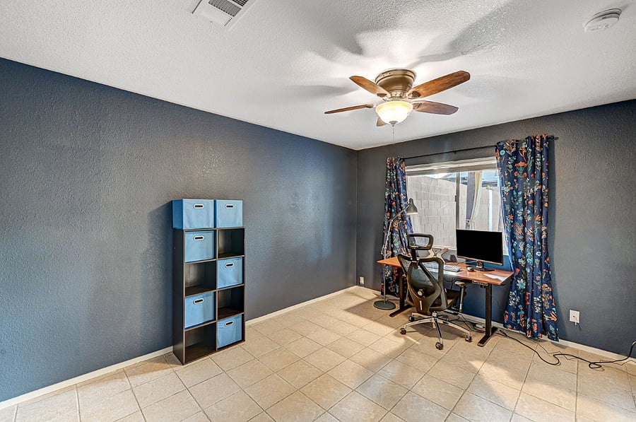 Office with an adjustable office desk and a comfortable chair