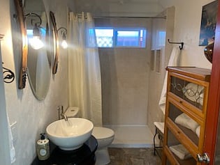 Italian marble walk-in shower cabinet to the right private shelving for towels and accessories towels are provided as well as Q-tips toothpaste extra toothbrushes Hairdryer 