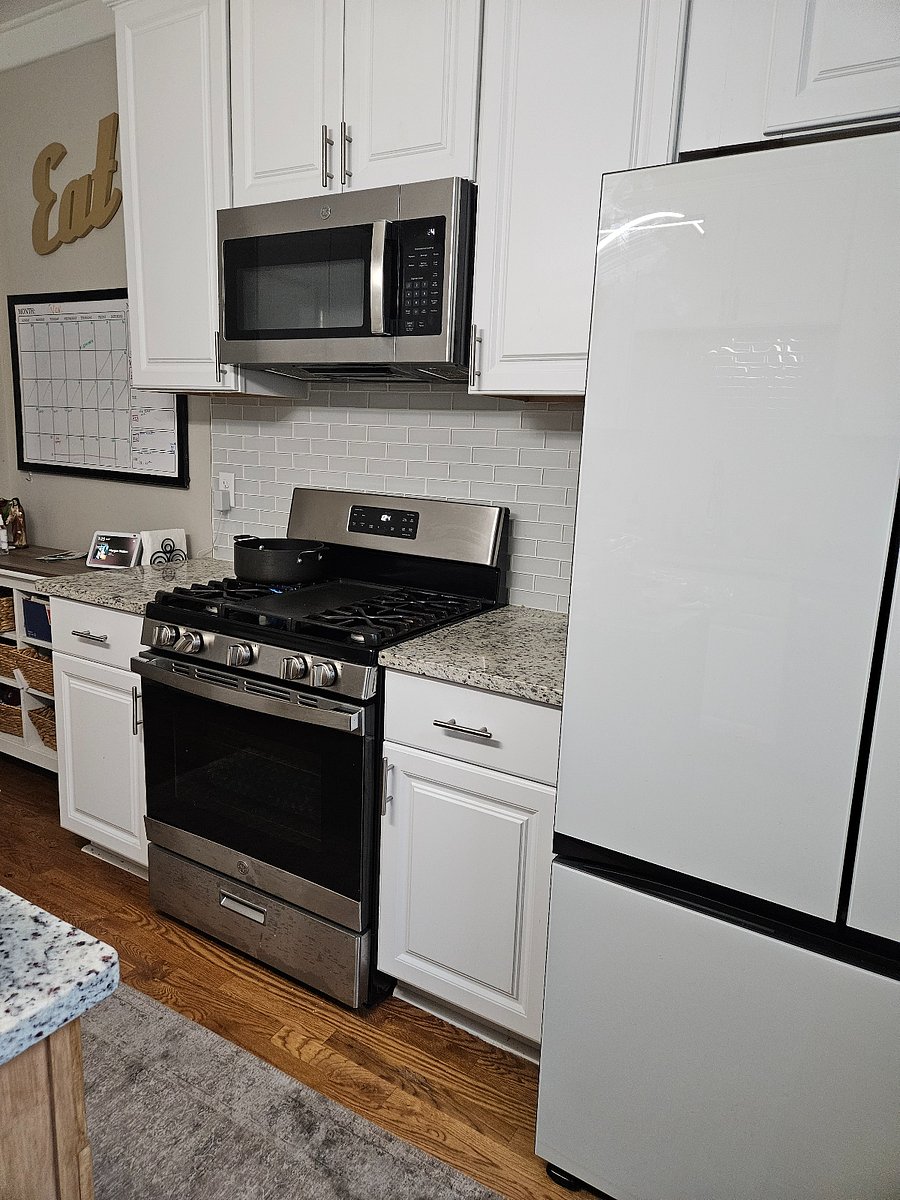 kitchen,granite countertops and island. glass tile backsplash