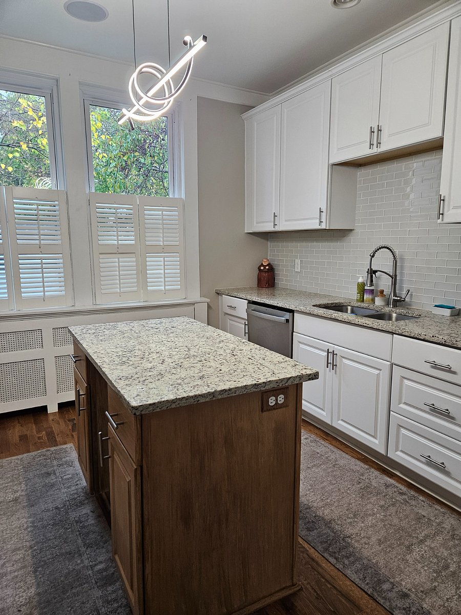 kitchen,granite countertops and island. glass tile backsplash
