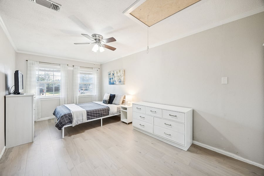 3rd bedroom with queen bed and laundry room