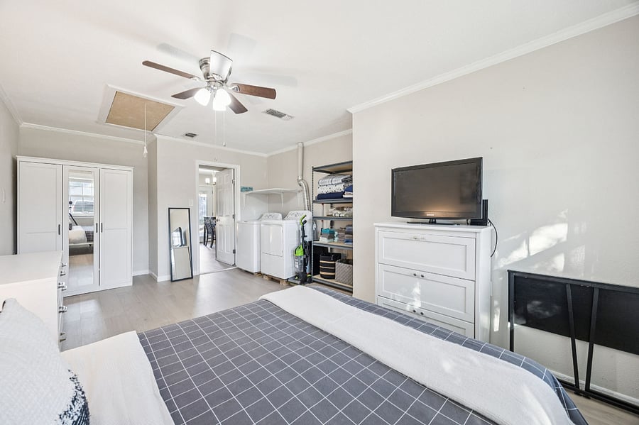 3rd bedroom with queen bed and laundry room