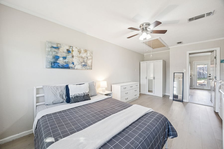 3rd bedroom with queen bed and laundry room