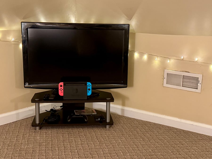 The attic space includes a Amazon Fire stick-enabled TV and a playable Nintendo Switch console 