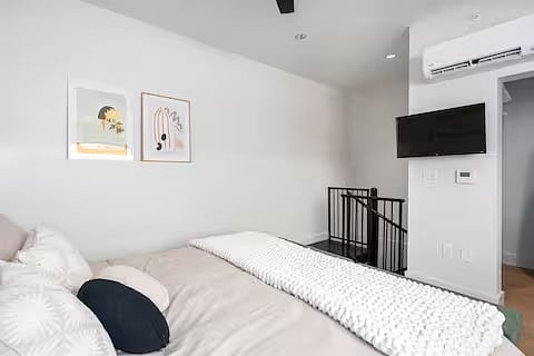 Bedroom, Second floor. King size bed, TV, walk in closet with chest of drawers, mirror