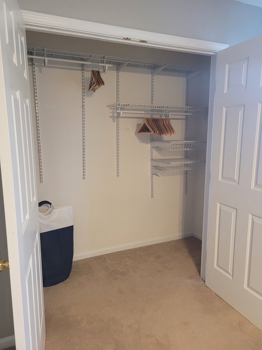 Spacious Second Bedroom: XL Closet with Organizer, spans the full width of the bedroom. Additional storage is available to the left behind the closet door (not shown).