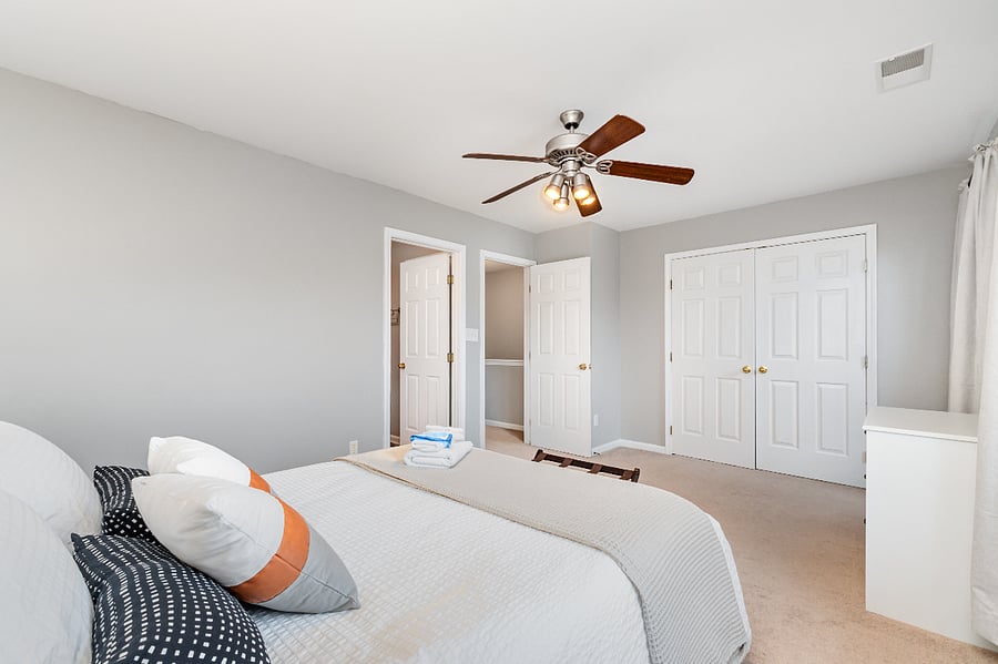 Second bedroom includes wall-to-wall closet with ample storage, as well as a semi-private ensuite with bath tub