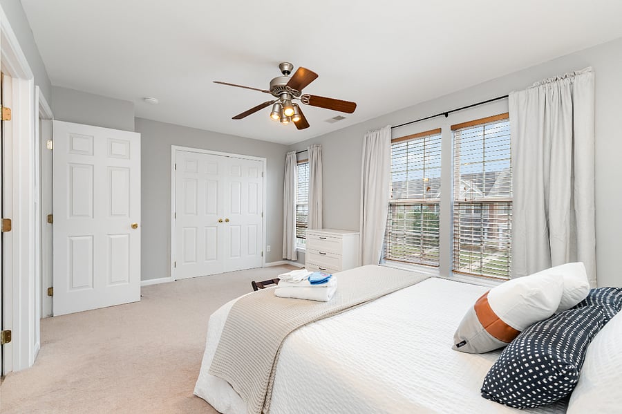 Second bedroom enjoys plenty of natural light, and includes blackout curtains for shift workers and sensitive sleepers.