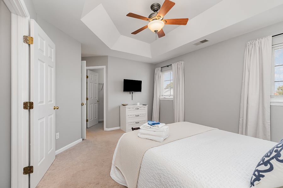 Master Bedroom with Smart TV, walk-in closet, private ensuite and dresser for additional storage