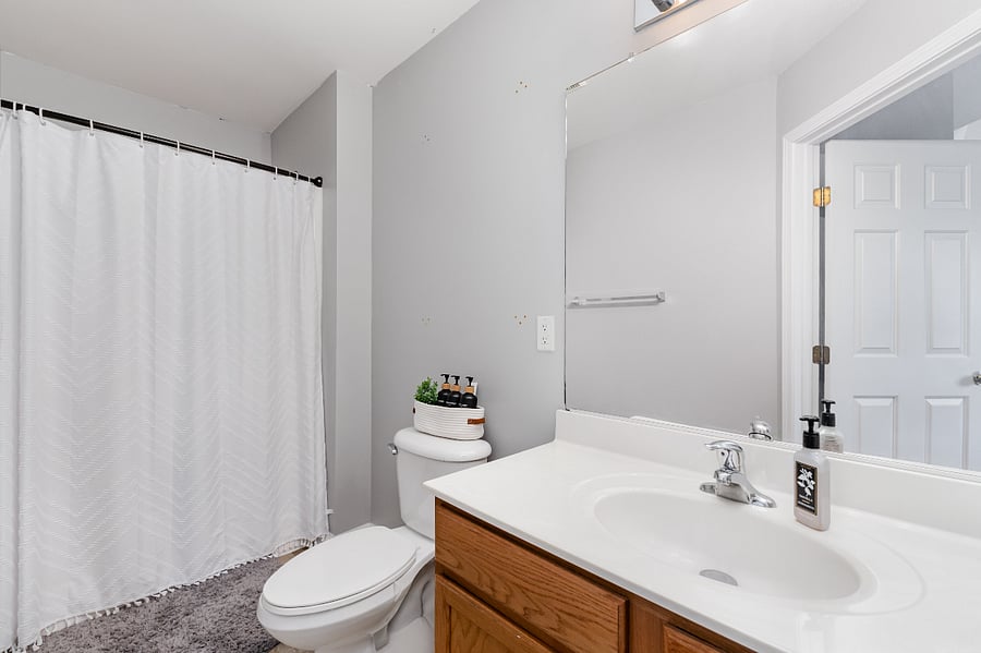 Master bedroom private ensuite with waterfall shower head and starter toiletries