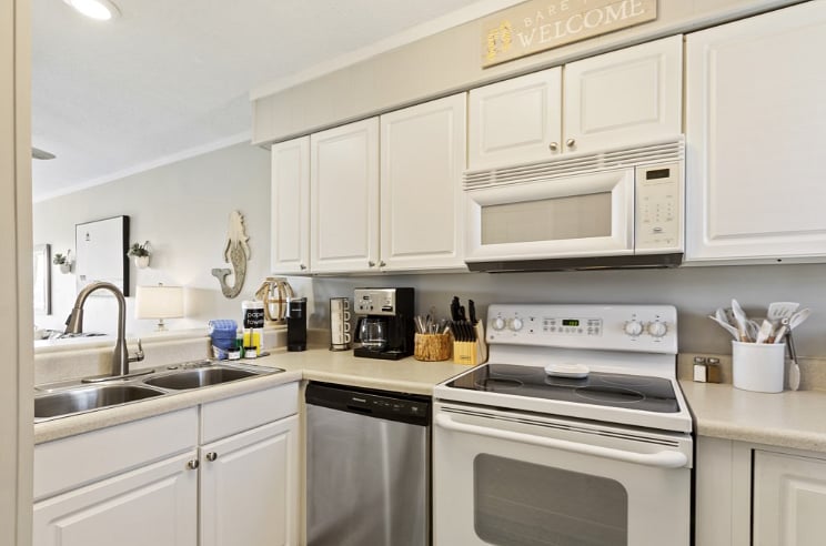 Full kitchen with cooking & dining ware