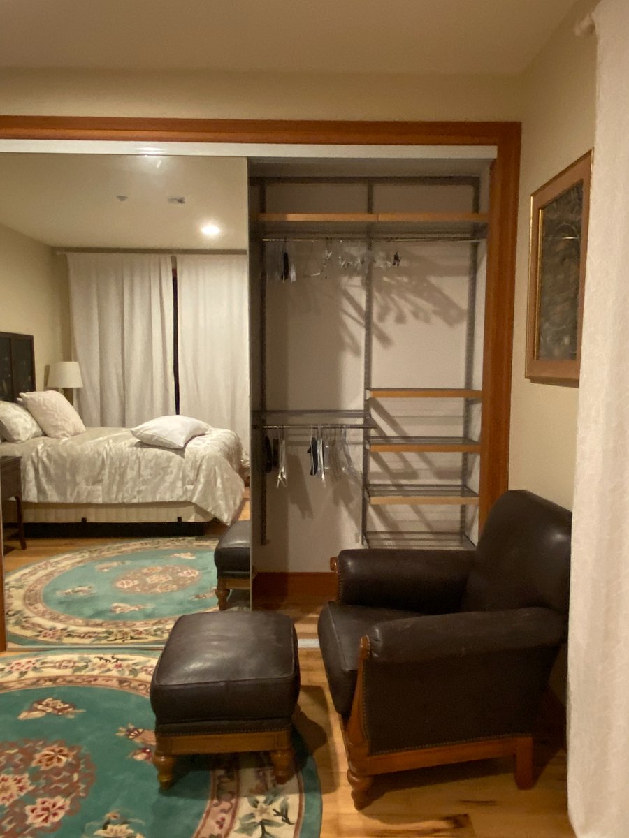 Large closet with mirrored door, right side.