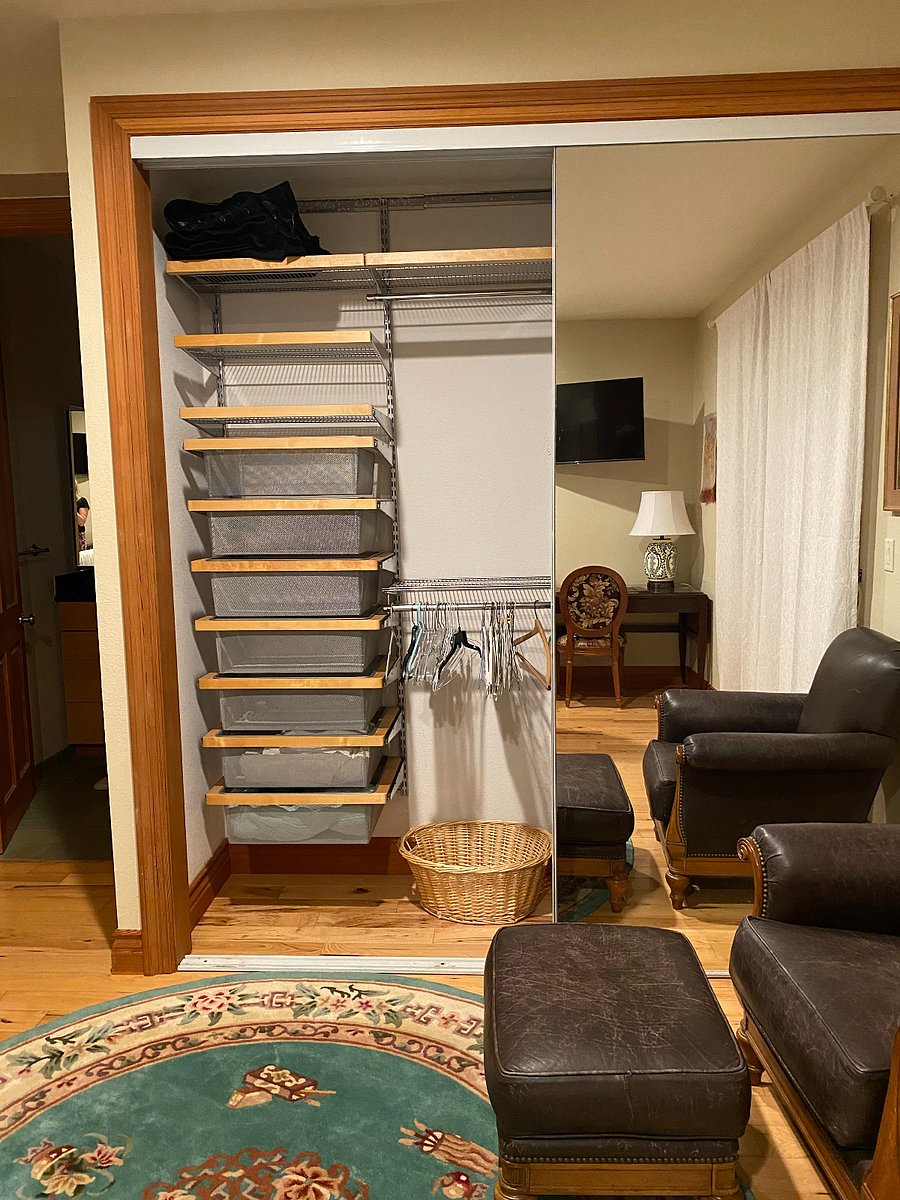 Large closet with mirrored door, left side.