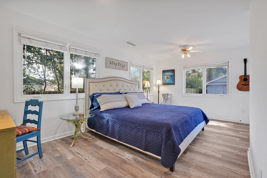 King Sleep Number bed, end tables, chest of drawers, access to back deck & ROKU TV in this room.