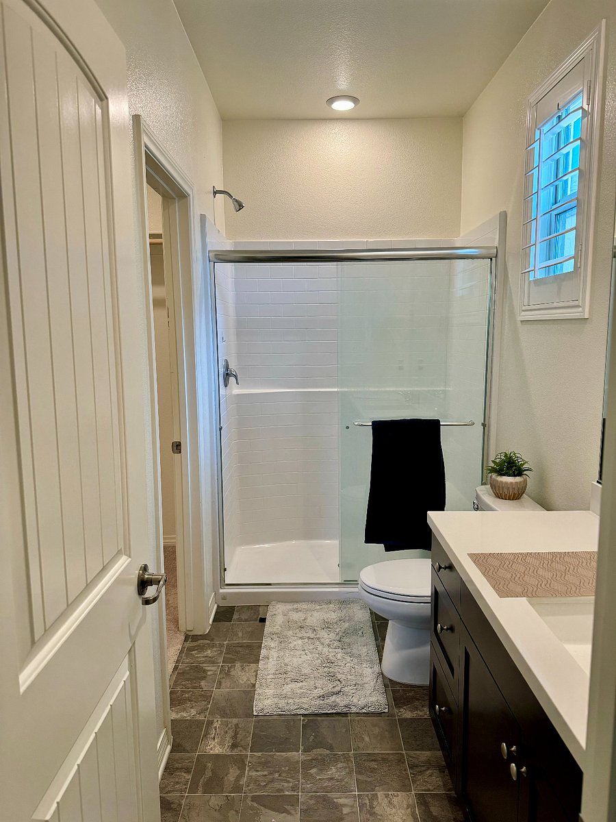 Sliding glass door shower.