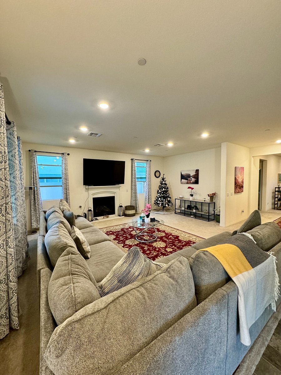 Large and cozy common space with 70" smart TV and fire place.