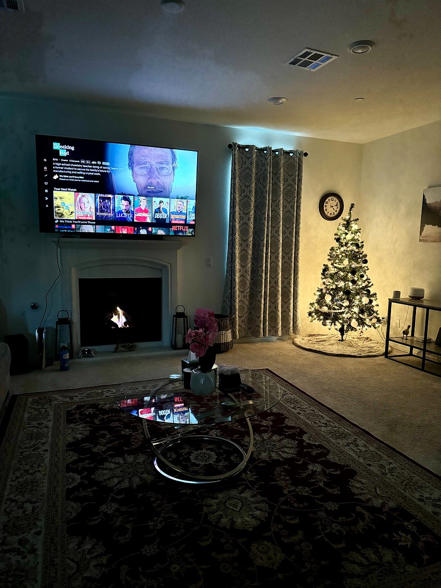 Large and cozy common space with 70" smart TV and fire place.