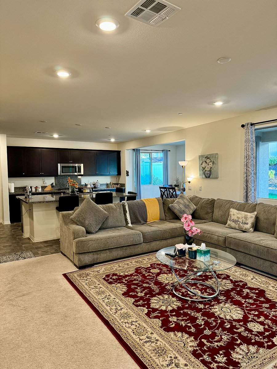 Large and cozy common space with open concept flow into kitchen and dining area.