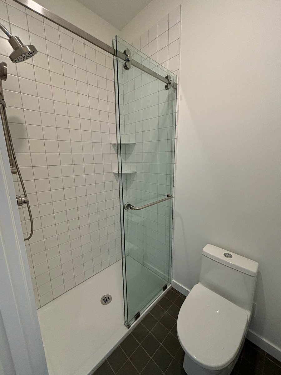 Private bathroom with dual head shower.
