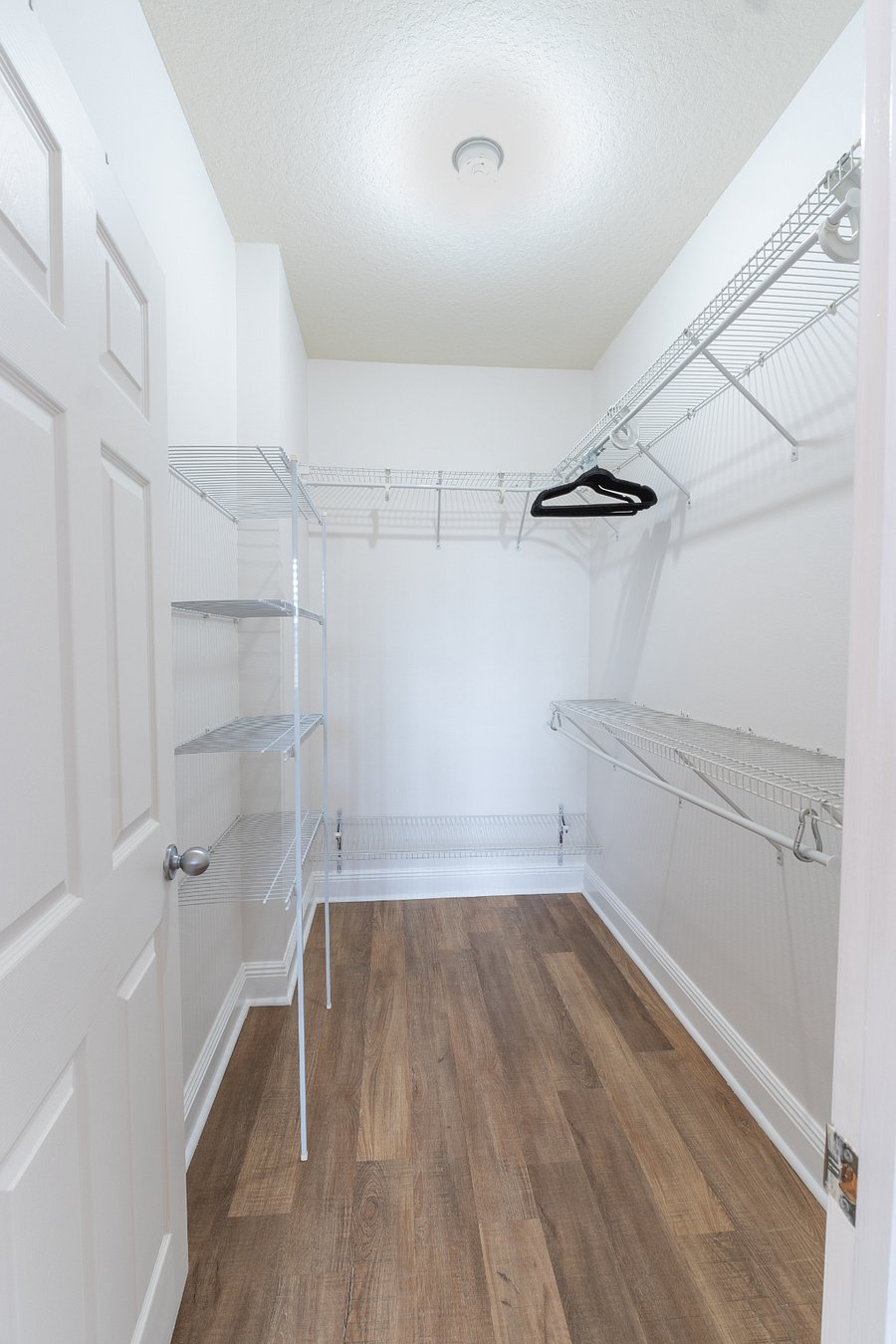 Master bedroom (sleeps 2): King bed, walk-in closet, dresser, smart TV, private full bathroom with essentials and ample storage, ceiling fan