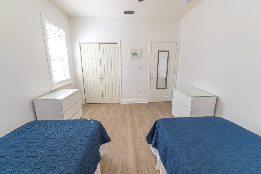Guest room (sleeps 2): 2 Twin XL beds, closet, dressers, ceiling fan
