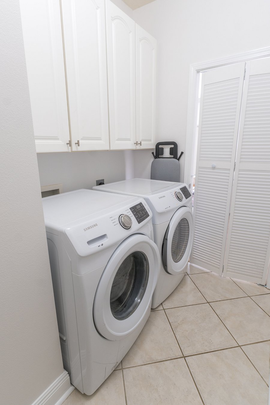 Laundry room: Washer, dryer, iron, ironing board
