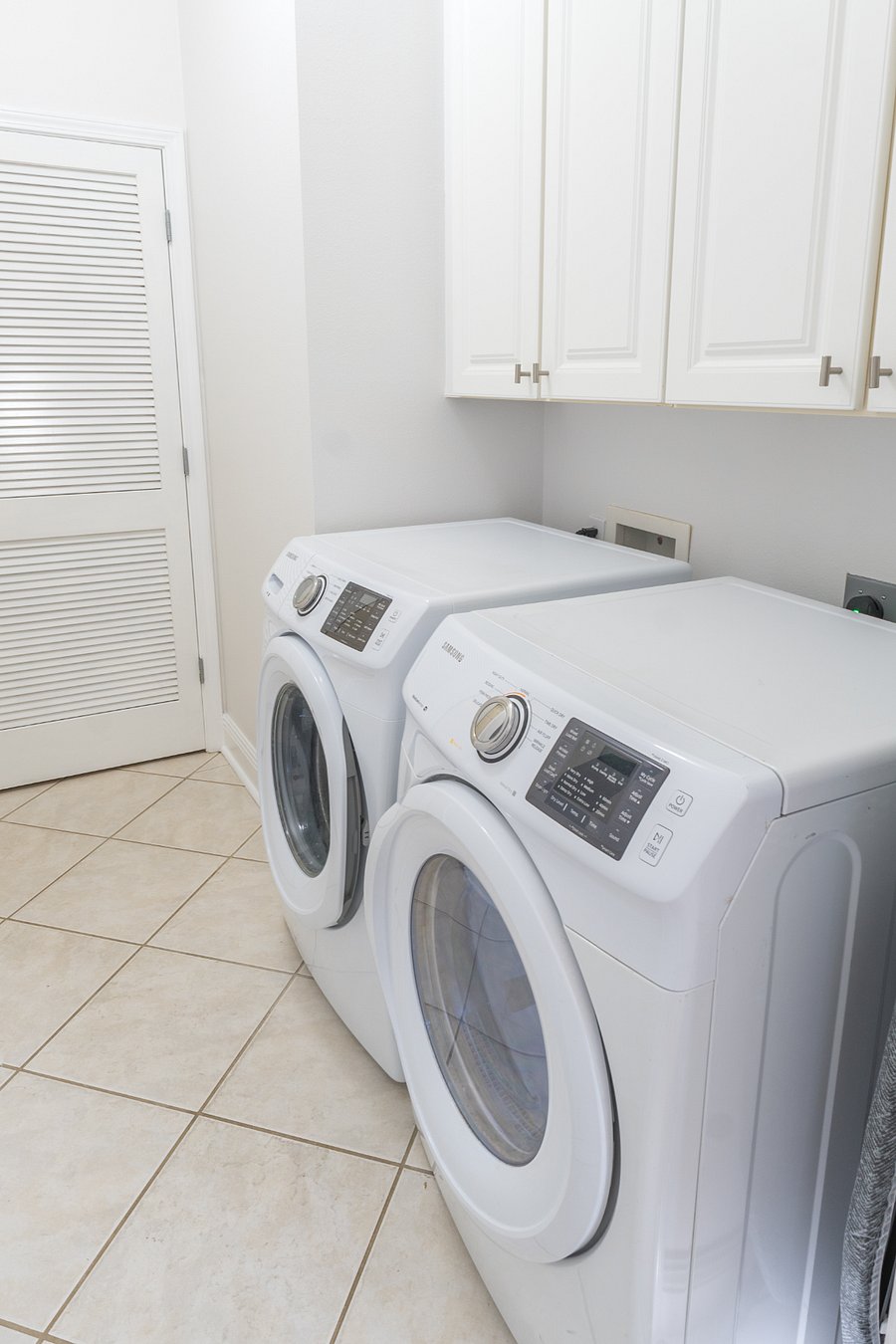 Laundry room: Washer, dryer, iron, ironing board