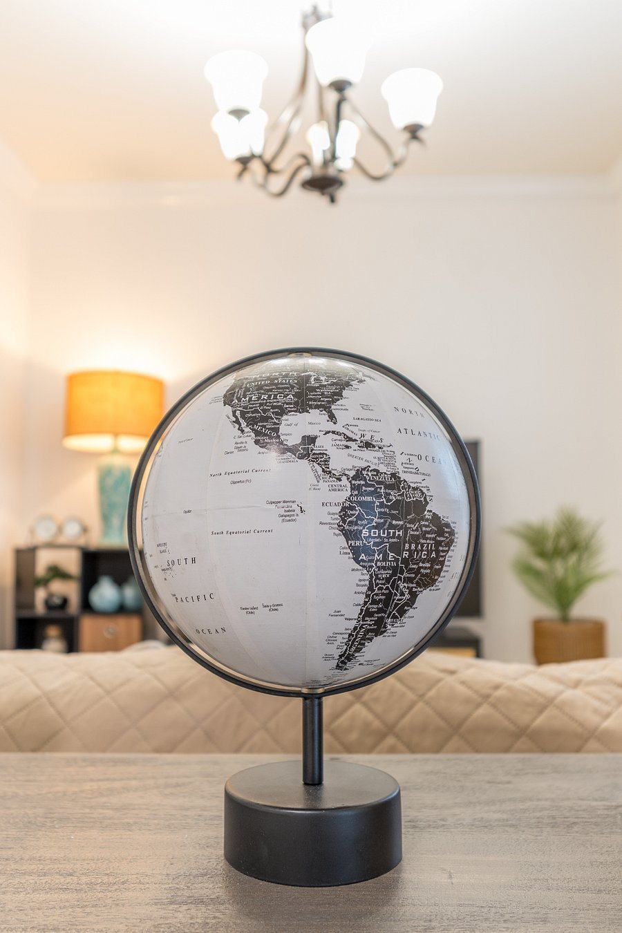 Living room: Smart TV, plush couch, board games