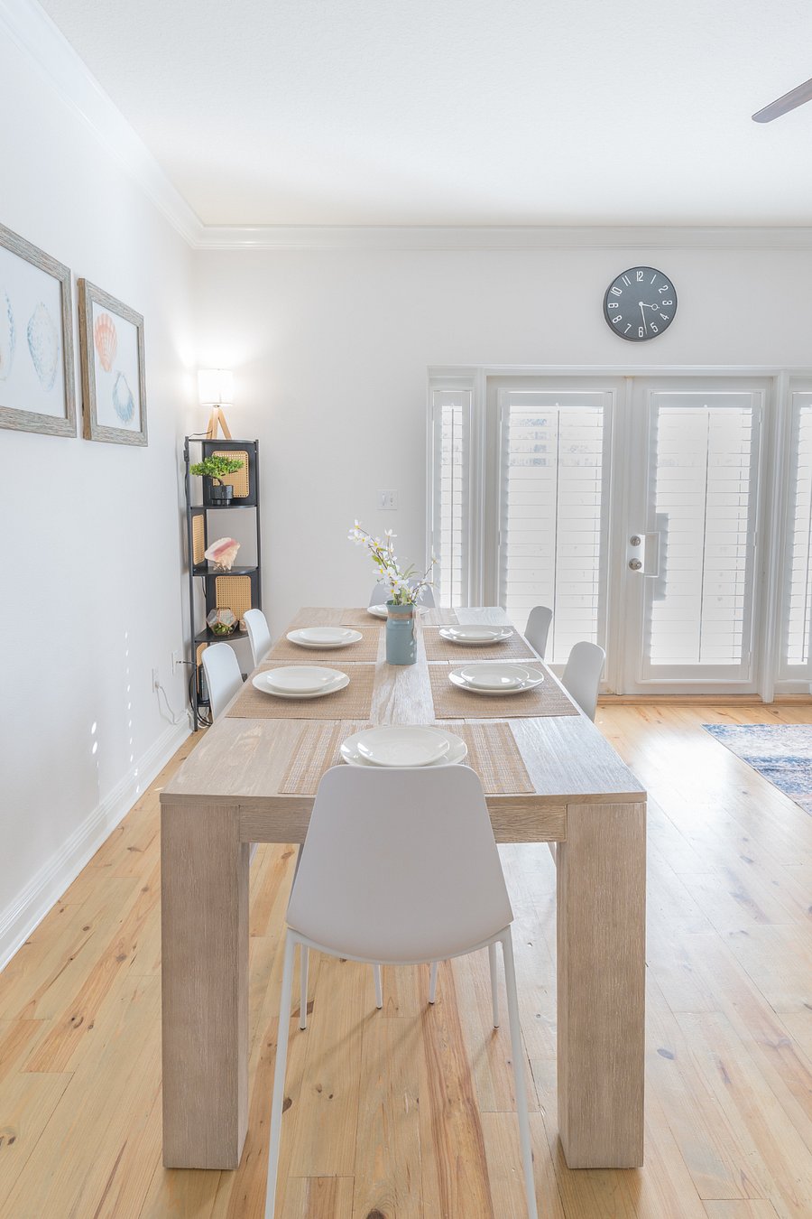 Dining area: 6 person dining table, 4 person bar, plush couch, ceiling fan