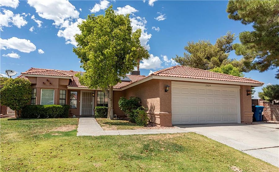 Front yard, driveway and 2 car garage