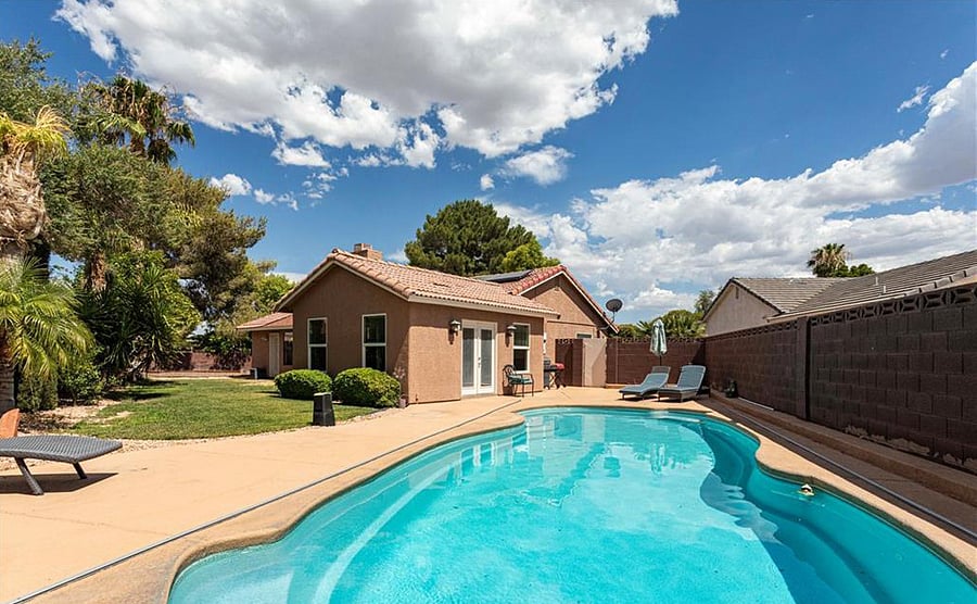 Backyard with pool and grilling area