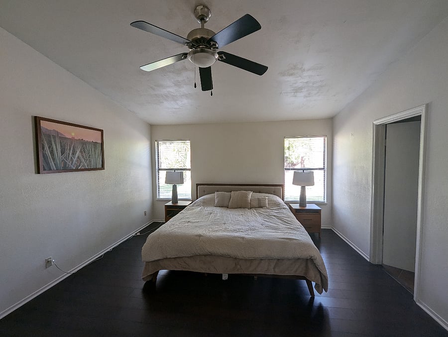 Spacious primary bedroom with new bed, mattress and linens.