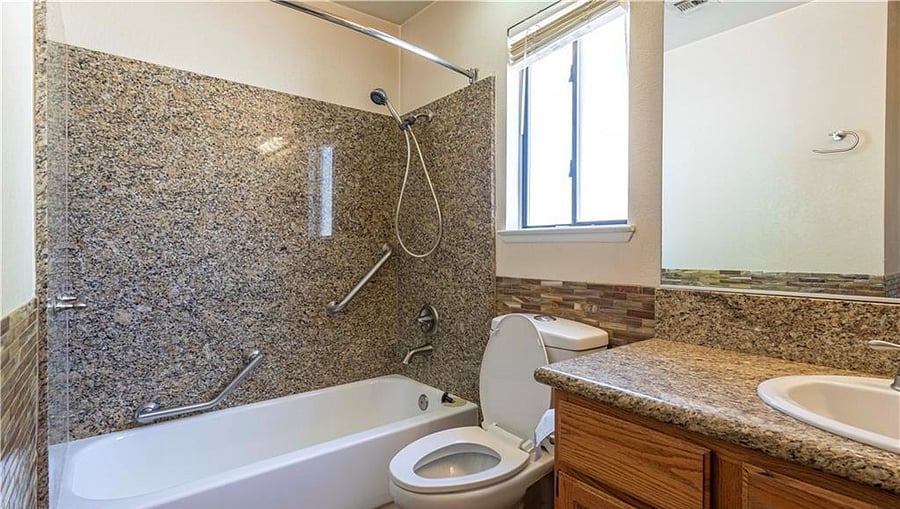 2nd bath/guest bath with bathtub and safety bars