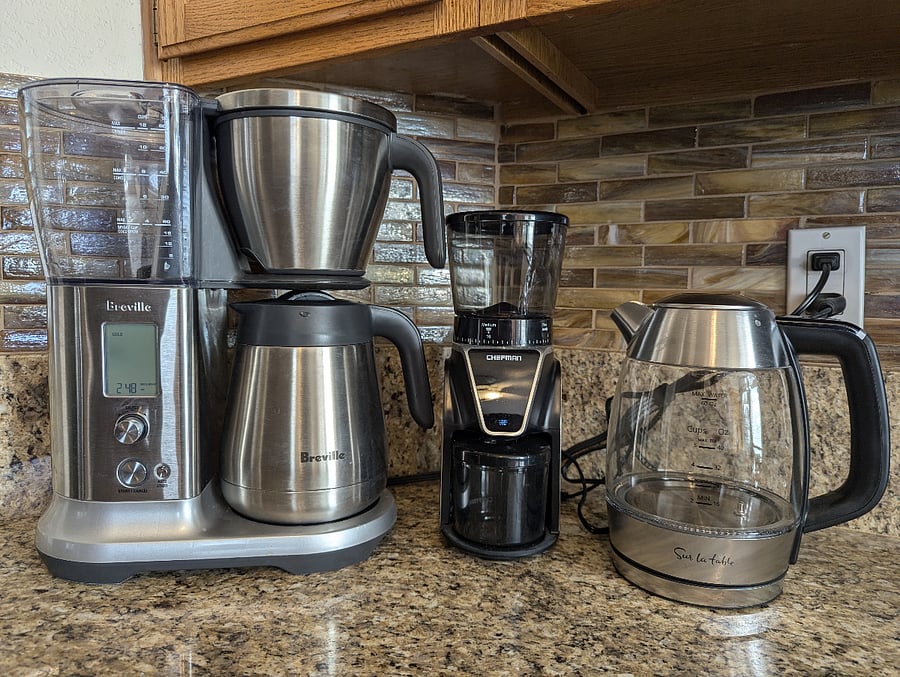 Gourmet coffee and tea station with Breville drip coffee maker, French press, and Sur la Table kettle