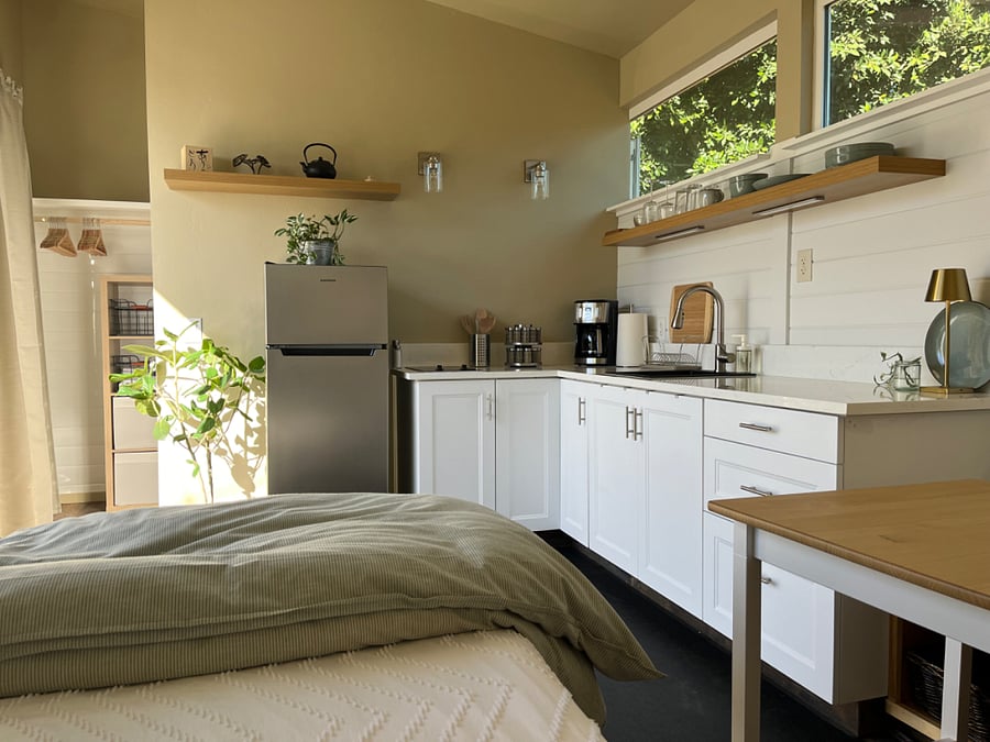 Full kitchen and a full sized refrigerator 