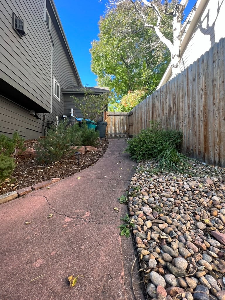 Entry gate and pathway to separate entrance.