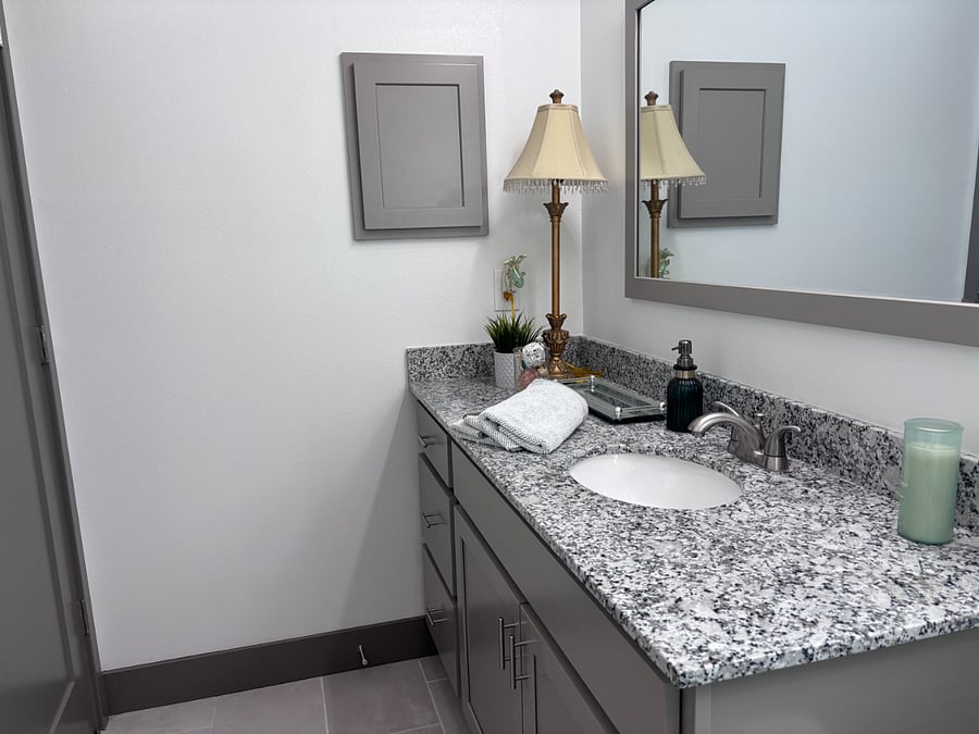 The three drawers are available for your storage, cleaning supplies available under the sink, and there are additional hangers on the bathroom door.