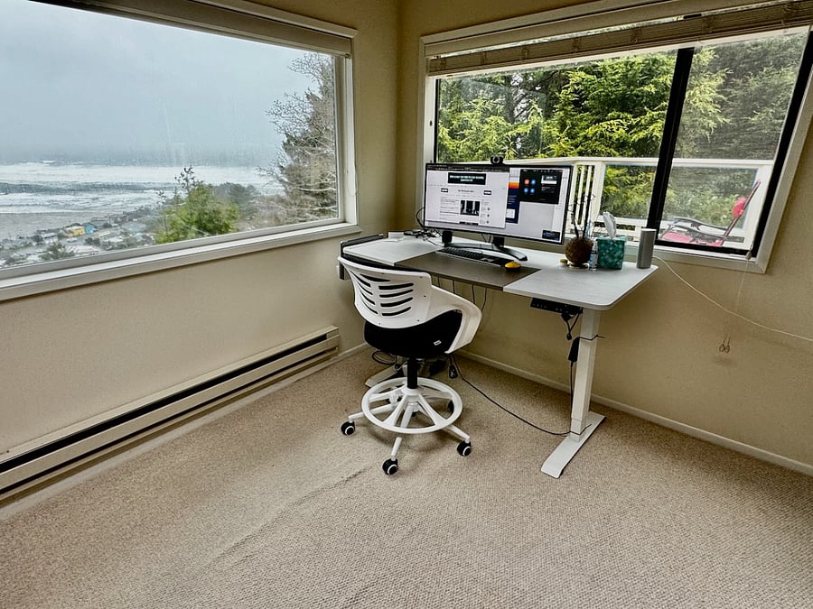 Office has views of the Ocean, deck and Cedar trees.