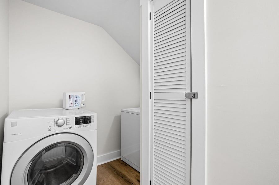 Compact and functional laundry space with a modern washer.
