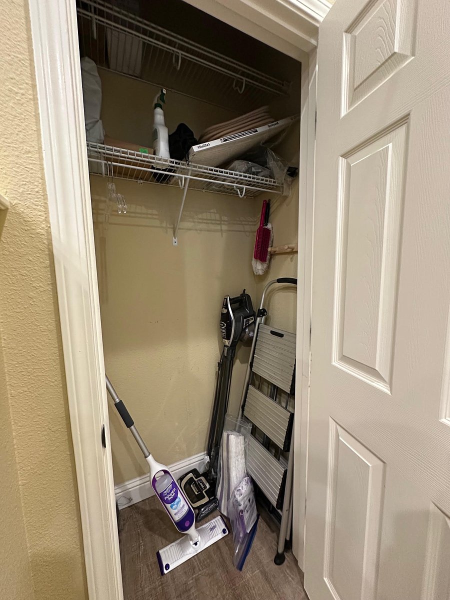 coat/storage closet at top of stairs