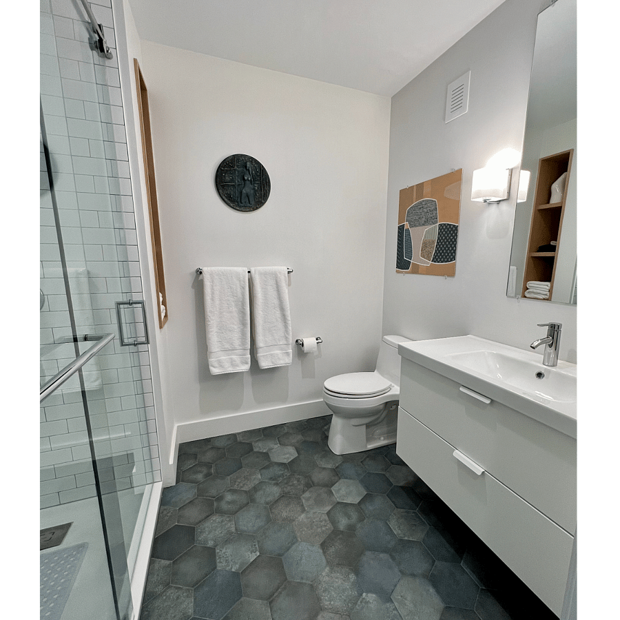 Sumptuous bathroom located off the bedroom gorgeous tiled floor and generous vanity with drawers to house your toiletries.